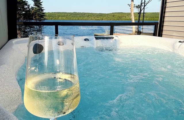The Luxurious Lakefront Reset on Porters Lake with private beach and hot tub!
