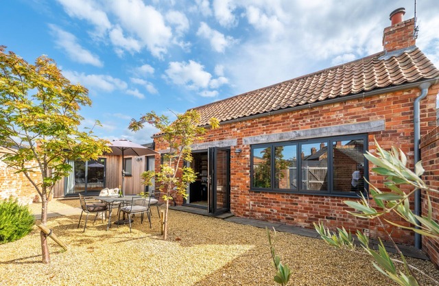 Détente sans effort, cette conversion de grange à aire ouverte de luxe