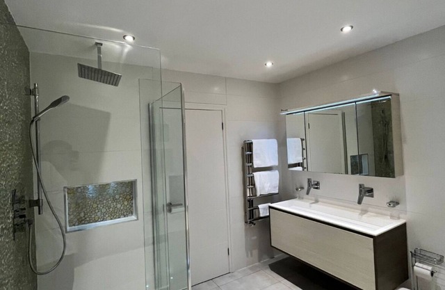 This luxurious home features an outdoor gym, hot tub, BBQ area and cinema room.