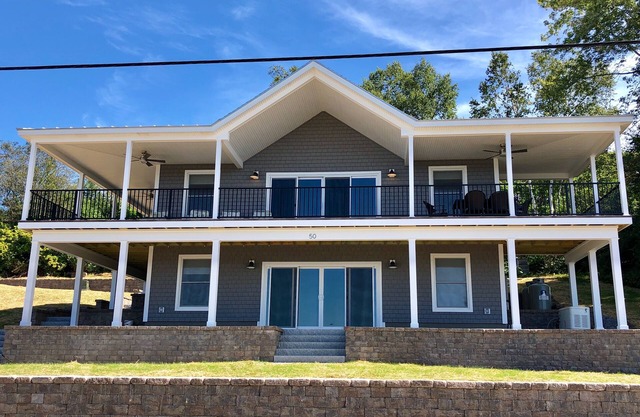This spacious home offers a FANTASTIC covered porch, perfect to spend your days gazing at the ocean!