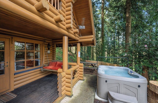 Timber lodge set in an elevated position with views of the lake.