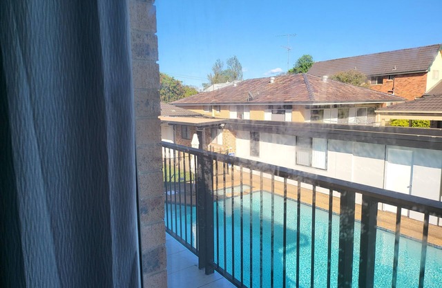 Top View Deluxe Self-Contained Room No 3 with Balcony Overlooking Swimming Pool.