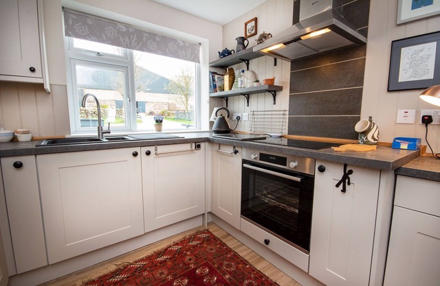 Traditional Highland semi-detached old stone cottage situated on a working farm