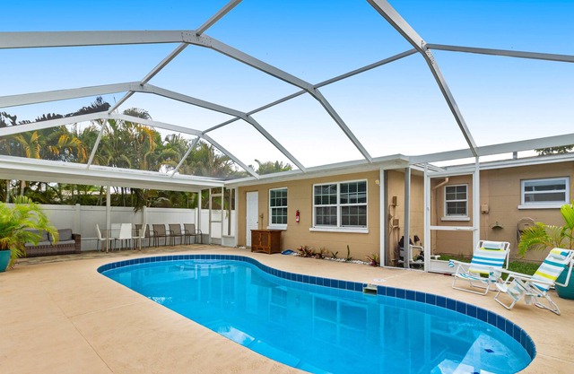 Tranquil escape with screened pool, fenced yard, lanai, & Pinellas Trail access