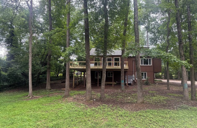 TREEHOUSE AVAILABLE JUNE 1st! A 5-bedroom with 2 driveways on 1.3 acres in City