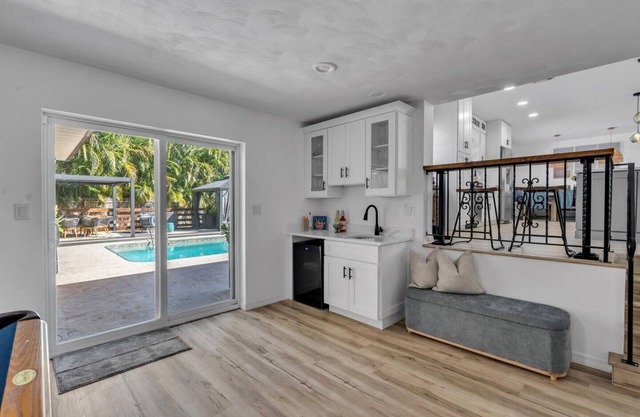 Tropical retreat in quiet, family-friendly neighborhood. Big backyard with pool & lots of amenities!