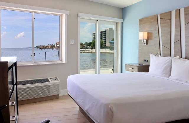 Tropical Retreat: Outdoor Pools, Private Beach, Waterfront Dining