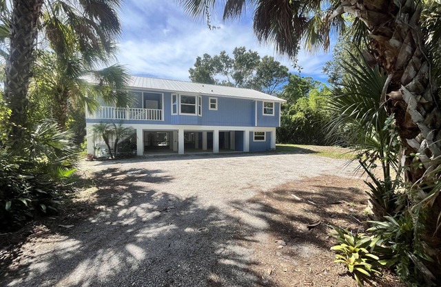 Tucked Away on Wooded Way located blocks from Manasota Beach with Heated Pool.