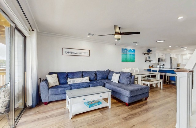 Two-story water view retreat with a pool, washer/dryer, AC, & balcony