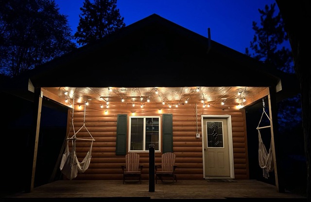 Woodsy Retreat by Snowmobile Trails with Indoor Fireplace & Outdoor Sauna!