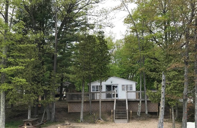 Up North, Comfortable Cabin steps from Bass Lake and Minutes from Traverse City!