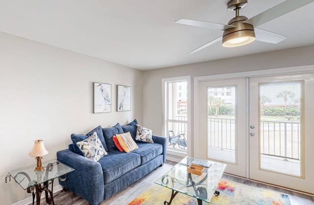 Updated condo with balcony, central AC, pools, hot tub, grills, & beach access