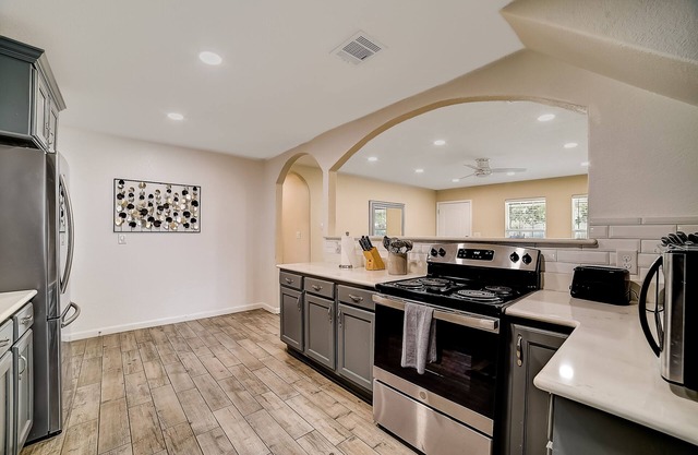 Updated, dog-friendly home with fenced yard, grill, sunroom, & W/D