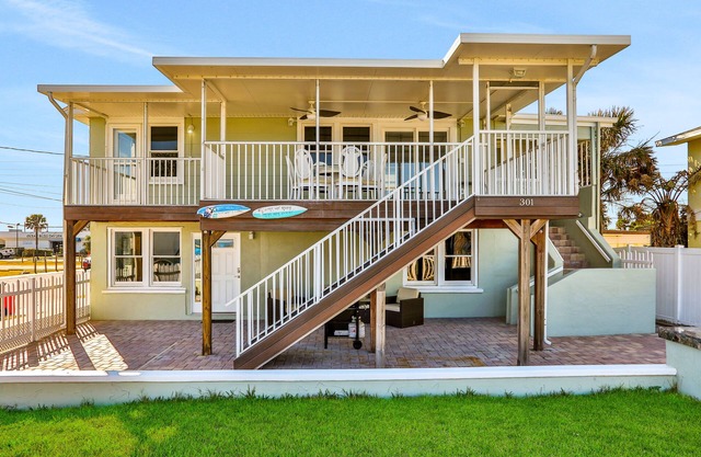 Updated home across from beach with covered balcony, central AC, & washer/dryer