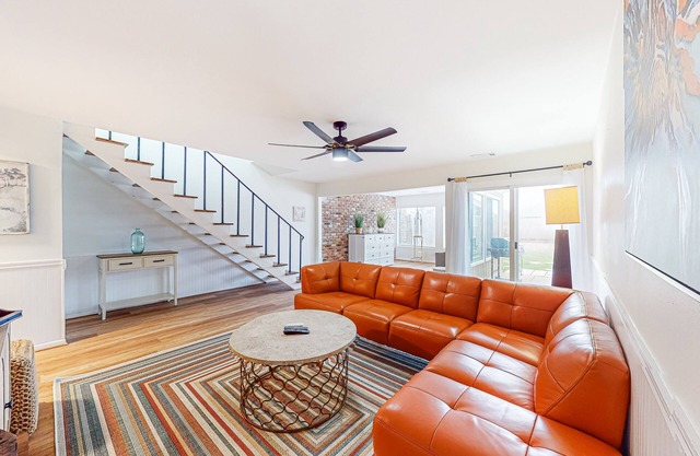 Updated townhome with grassy yard, grill, open layout, W/D, & AC