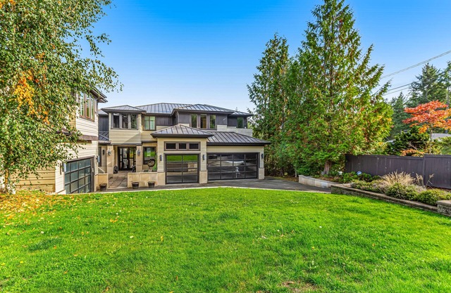 Luxury waterfront estate with private beach, dock, fireplaces, & gourmet kitchen