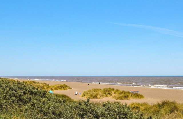 Views inland across the fields and only 100 yards to the unspoilt sandy beach at Anderby Creek.