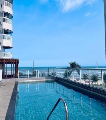 Vila Caiçara Apto à beira mar! Novinho