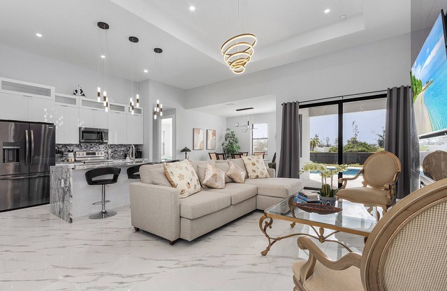 Villa Del Sol Vacation Pool home with outdoor TV and work/office room.