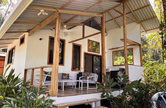 Villa Green Macaw Comfortable Beach Front Villa, sea breezes, Tropical gardens