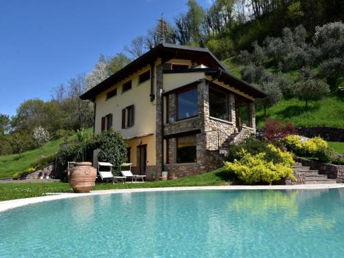 Villa in Pisogne with pool, garden and lake view