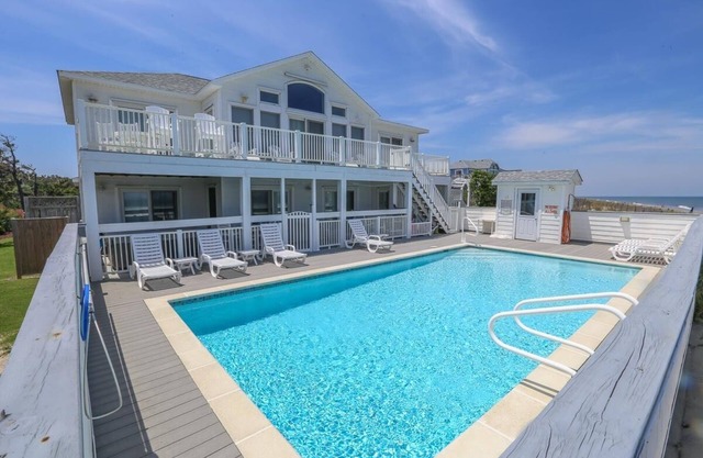 Wake up to an Outer Banks sunrise from this luxurious oceanfront home