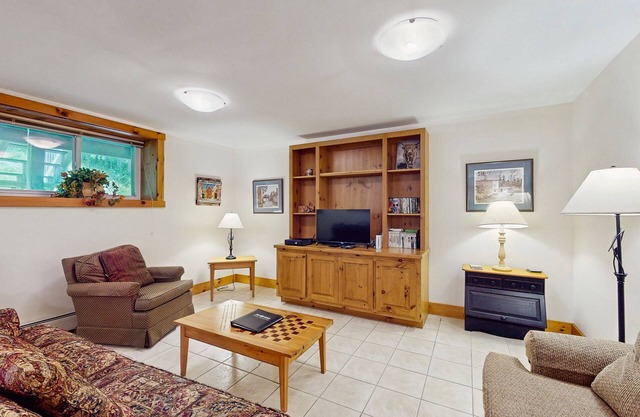 Walk to lifts basement condo near water park & golf course with deck