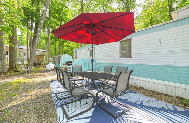 Walk to Manistee Lake: Retro Cabin w/ Fire Pit!