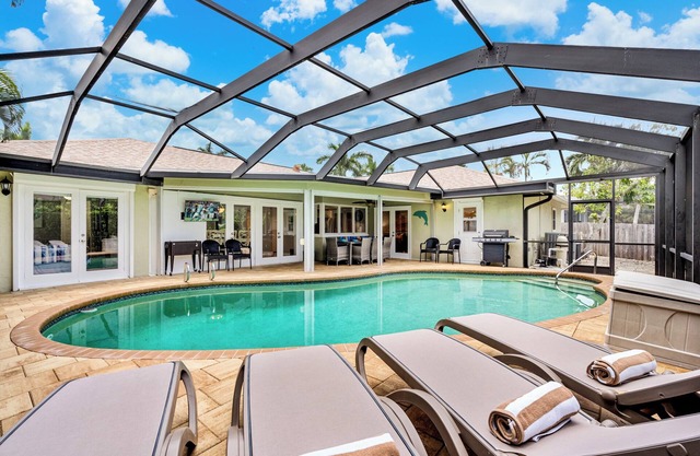 Walk to the beach, restaurants, and shopping! Enjoy your own private heated pool