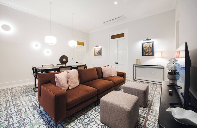 Warm, bold, and modern—Balluta 12B Suite Residence exudes luxury through earthy tones, plush textures, and artistic flair, all set in a historic palace overlooking the calm beauty of Balluta Bay.