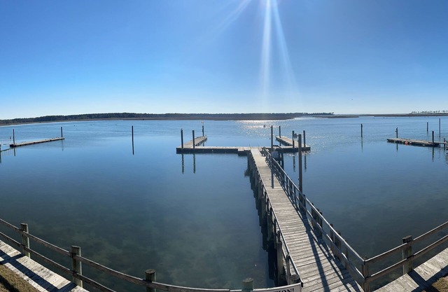 Waterfront, 2nd floor. Dedicated boat slip. Great view of ponies and lighthouse.