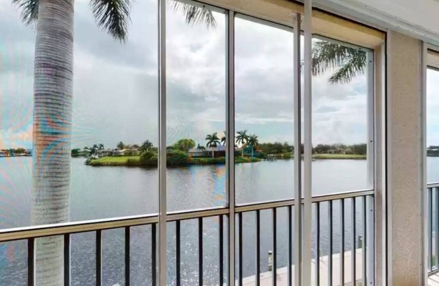 Waterfront 3 bed 3 bath Condo 2nd floor with garage and private boat slip