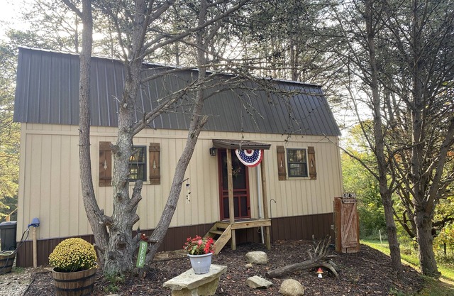 Secluded cabin nestled on 6.5 acres. Close to Burr Oak, Hocking Hills, & OU.
