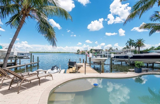 Waterfront Getaway with Boat, Pool & Walk to Beach