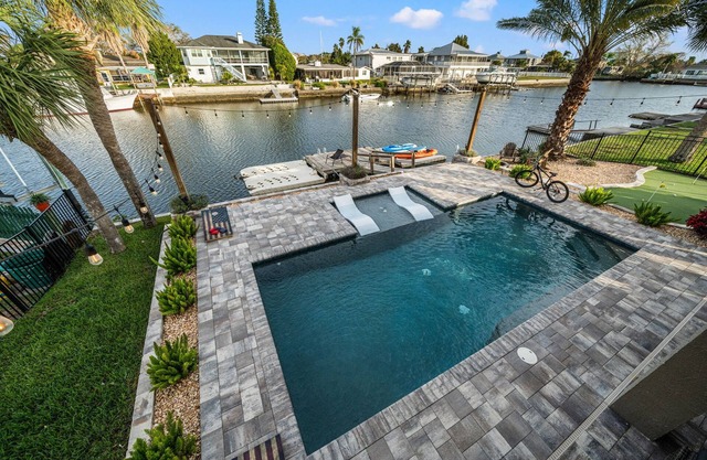 Waterfront home w/ direct gulf access + pool + hot tub + activites!
