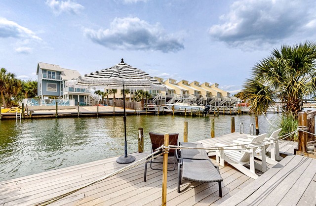Waterfront home with tennis/boat dock access, deck, grill, & W/D