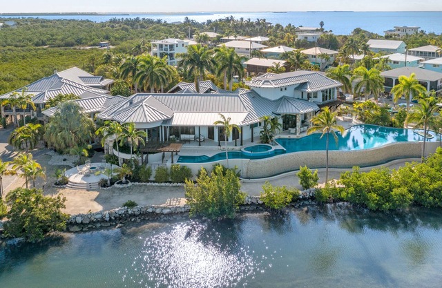 Waterfront villa with pool, outdoor areas, home gym, & fillet station