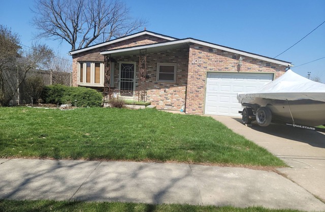 Waterfront House with Boat Dock on Detroit River Channel. Fish from the backyard