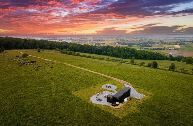 we invite u to come experience this off grid tiny home on top of a grassy hilltop.