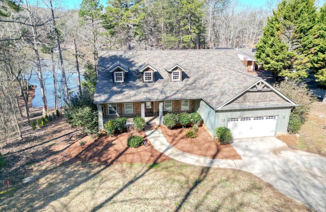 Welcoming home with huge deck overlooking lake. Pet Friendly!