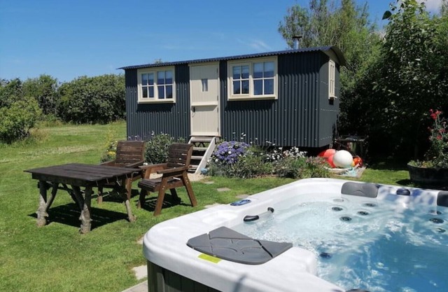 Willow Tree Shepherd's Hut with optional hot tub and shared EV charger.