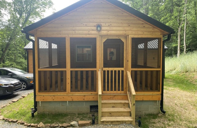 Winding road cabin screen front porch uncovered back porch