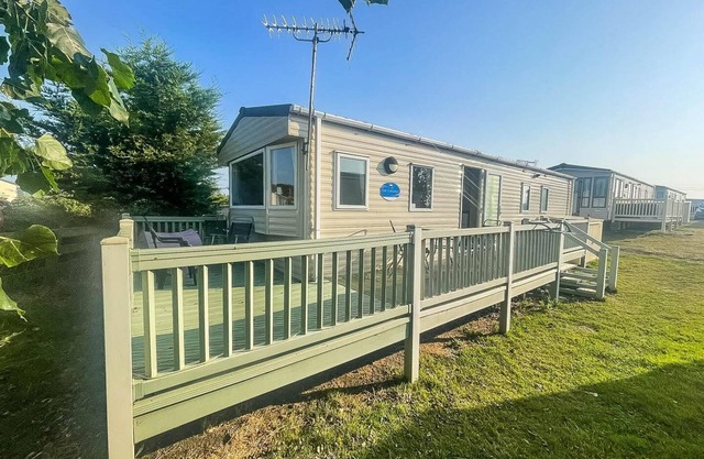 Wonderful 6 berth caravan with decking & river views at Heacham Beach ref 21003A