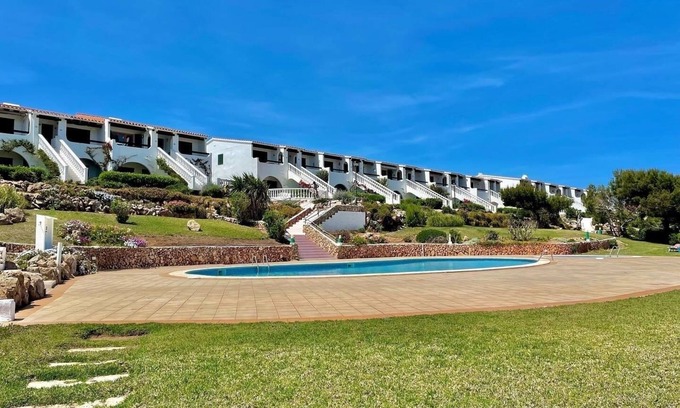 Arenal d'en Castell Appartement | Appartement avec piscine, jardins partagés et vue sur mer