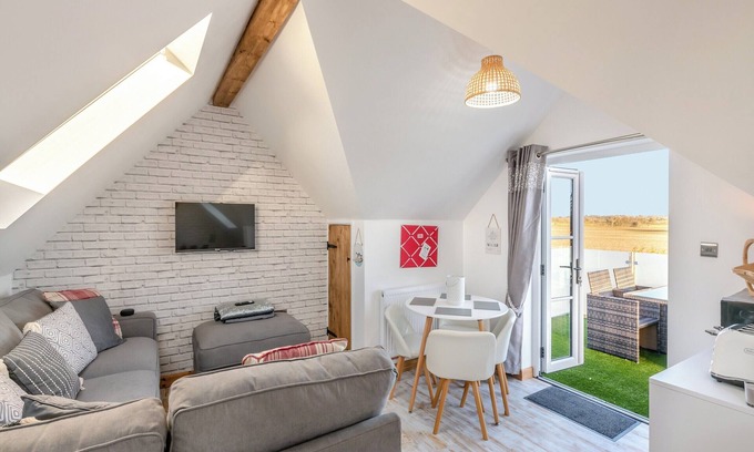 Layer Marney Cottage | Lovely stylish upside down house to make the most of the countryside views from lounge and balcony.