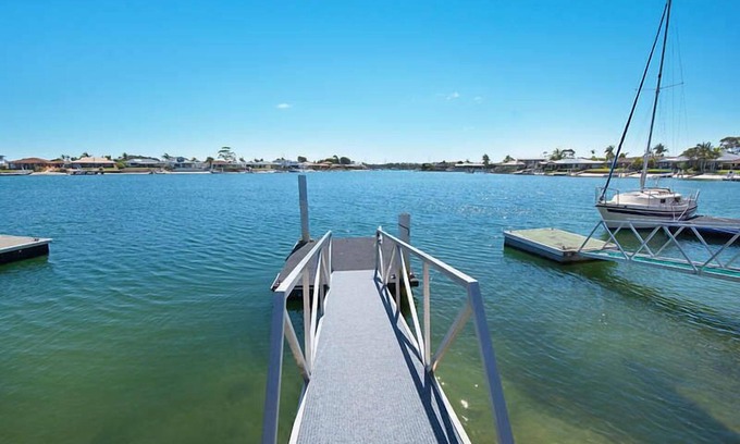 Yamba Maison | 21 MELALEUCA DRIVE, Waterfront with private boat ramp and pontoon -Pet Friendly