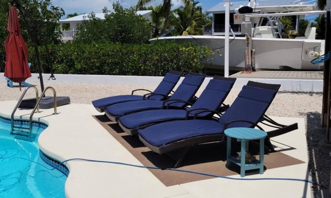 Breezeswept Beach Estates Maison | 3/2 two story home with pool and 80' dock on canal ocean side.