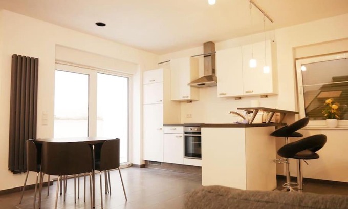 Gruenstadt Appartement | 3 ZKB Einliegerwohnung im Neubau (73m²) mit Ladesäule