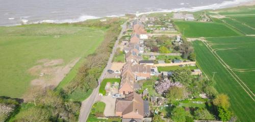 Happisburgh Maison | 4 bed house 50 yards from the beach & lighthouse