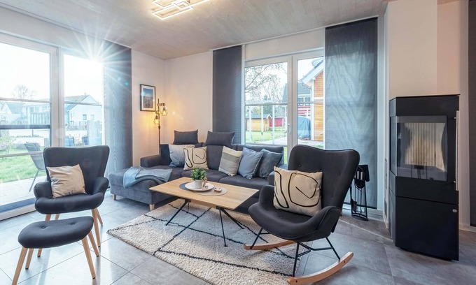 Fuhlendorf Maison | 5-star vacation home Ostseetraum on the water with fireplace, terrace and Bodden view